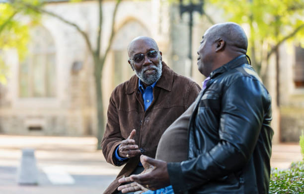 istock Two senior African-American men talking in city park 2173201964