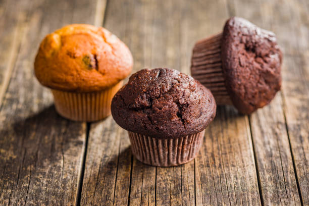 istock Sweet chocolate muffin cakes. Cupcakes on wooden table. 2173202221