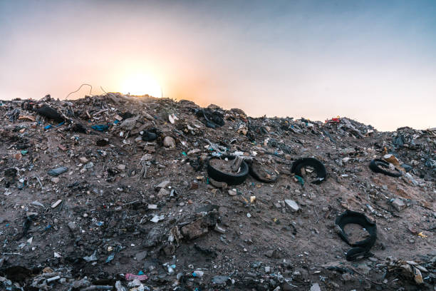 Garbage Dump, Basurero Municipal, in San Luis, Sonora Mexico with Worn-Out Vehicle Tires at Sunset