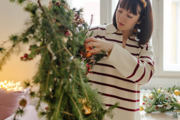 istock Young woman making a Christmas wreath 2173206120