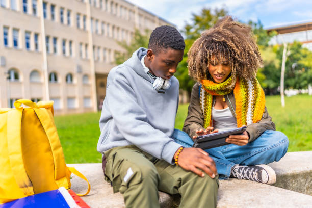 istock Multiethnic young students studying together in university campus 2173208860