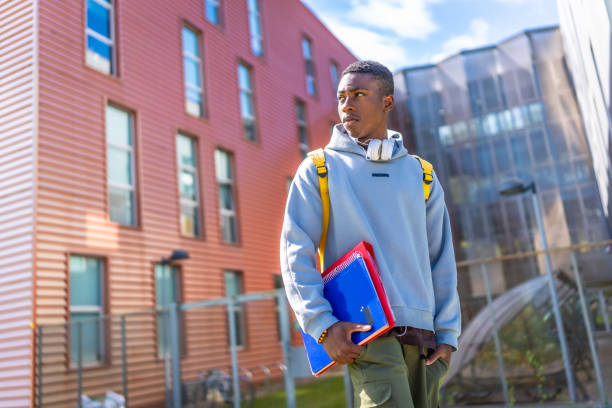 istock Confident african student standing outside the university 2173208982