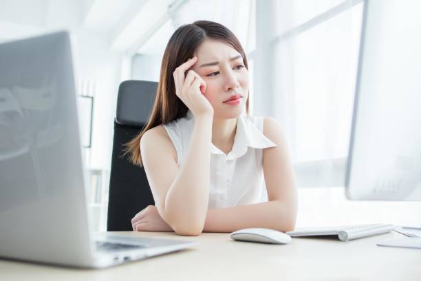 istock A young Asian businesswoman is looking at her computer screen with a worried expression on her face. 2173210802