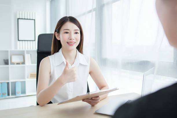 istock Woman On Phone In Busy Modern Office 2173214648