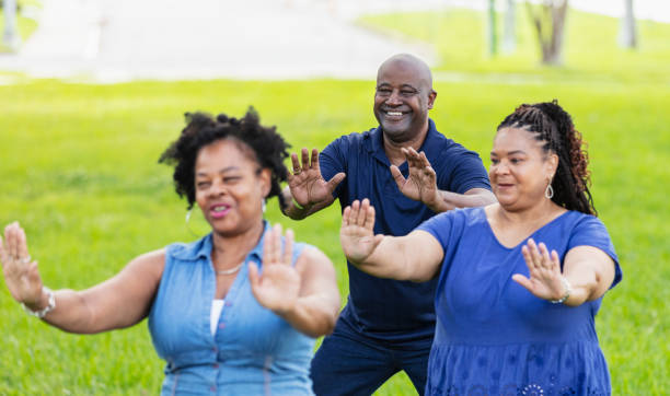 istock Three African-American seniors practicing tai chi at park 2173222981