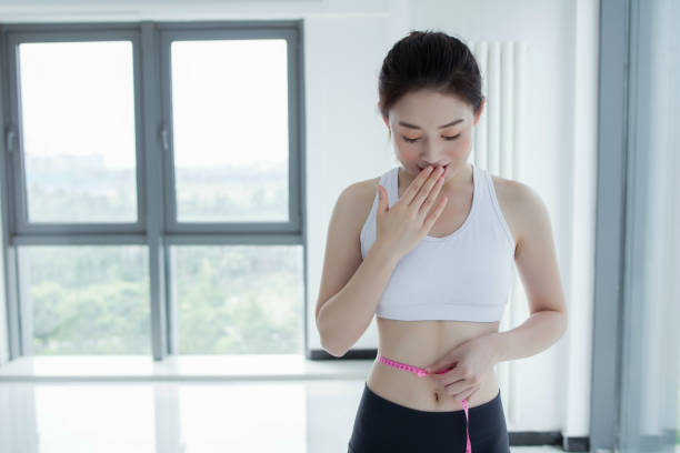 istock Slim waist with a tape measure around it 2173226924