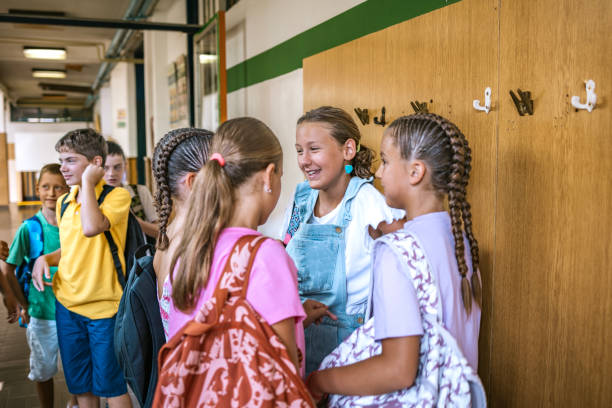 istock Students gathered in the school corridor chatting and enjoying their time before the class begins 2173227693