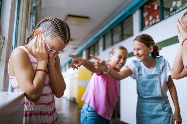 istock Students play harmless pranks on classmates in a school hallway during a fun break between lessons 2173227950