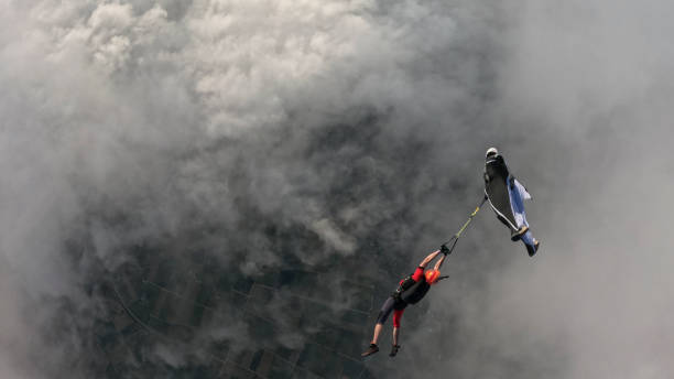 istock Wingsuit fliers perform mid-air stunt 2173229051
