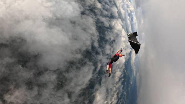 istock Wingsuit fliers perform mid-air stunt 2173229054