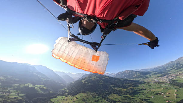 Personal perspective of skydiver landing (PLF, parachute landing fall) in Swiss Alps