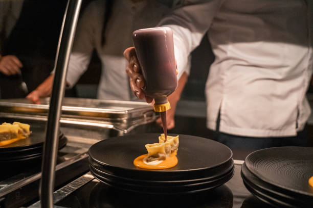 istock Chef puts final touches on meal in luxury restaurant 2173231923