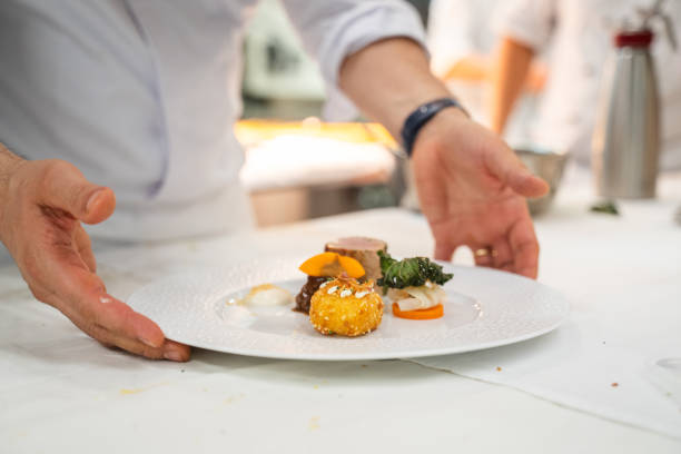 istock Chef puts final touches on meal in luxury restaurant 2173232168