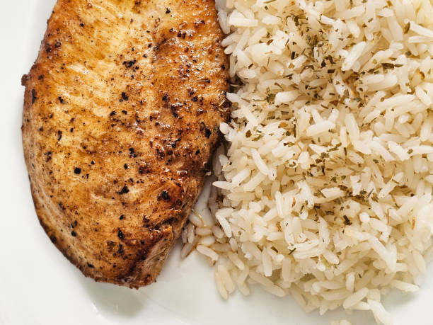Breaded cod fillets cooked with herbs and served with saffron rice