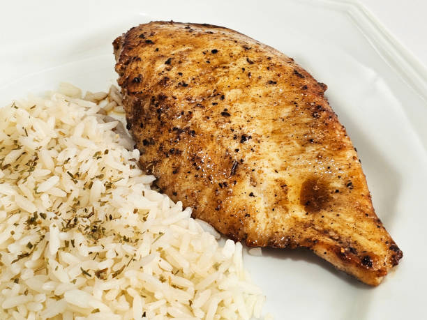 istock chicken breast fillet with white rice 2173238336