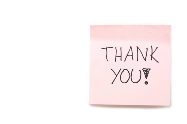 istock Hand writing THANK YOU on pink sticky note isolated on white background with clipping path. 2173240718