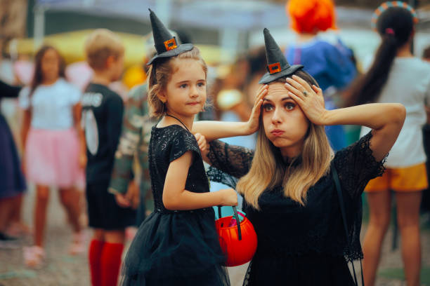 istock Worried Mom with Her little Kid Going Trick or Treat 2173241966