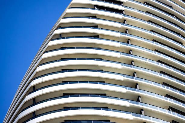 Closeup low angle view of modern corporate glass building, background with copy space, full frame horizontal composition