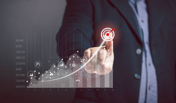 istock Businessman points target at graph on virtual screen, business growth, maximum profit cut point, stock exchange trading. Business, finance and marketing strategy for success investment performance. 2173244362