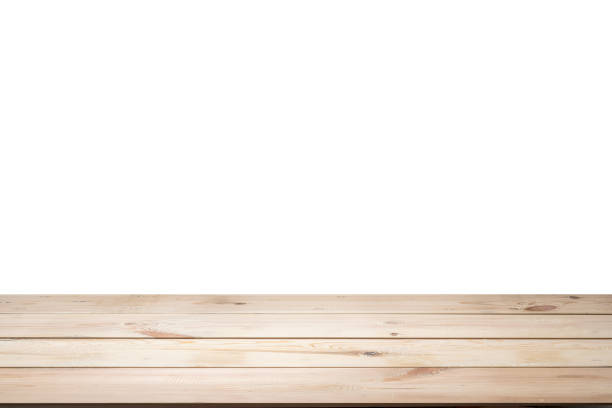 istock A wooden table is isolated over a white background. The table is empty and has a natural 2173245128
