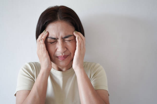 istock Woman holds her face and feels a headache. 2173245229