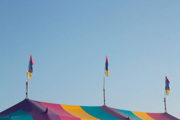 istock Vibrant multi-colored tent against a blue sky. 2173246808