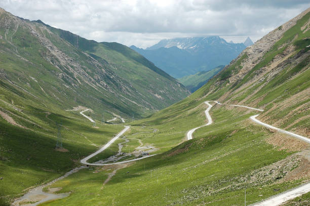 istock winding road on green mountain 2173250693