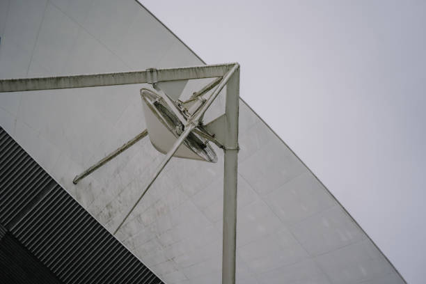Bavaria, Germany - September 14, 2024 - A close-up view of a satellite dish mounted on a metallic structure, part of a larger satellite communication facility.
