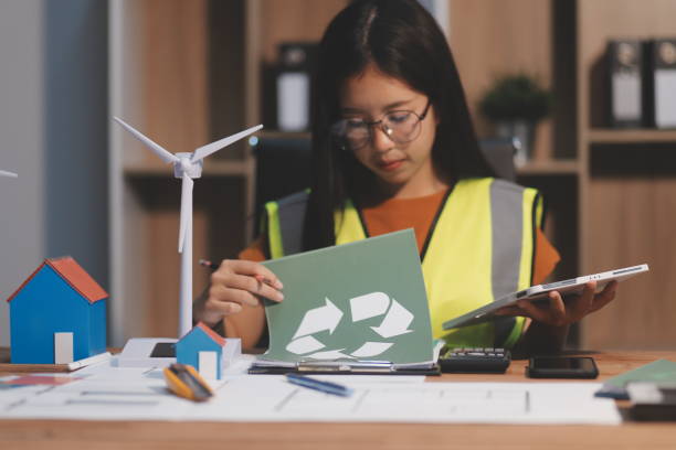 istock Female architect working at home She looked at the blueprint. 2173256915