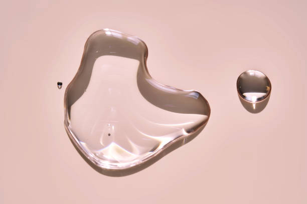 istock A drop of micellar water on a pink background. 2173257310