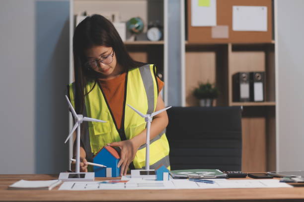 istock Female architect working at home She looked at the blueprint. 2173257417