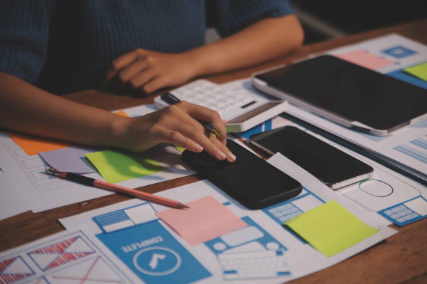 istock The designer team is designing the uxui system to make the uxui system work well on new phones and support system updates. Website development concept UI UX front end designer 2173259919