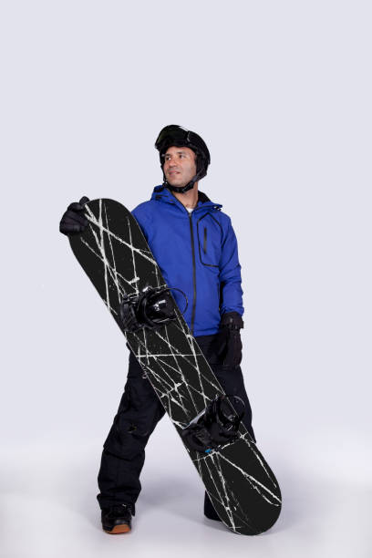 istock a snowboarder showcasing his equipment in a poised stance 2173270616