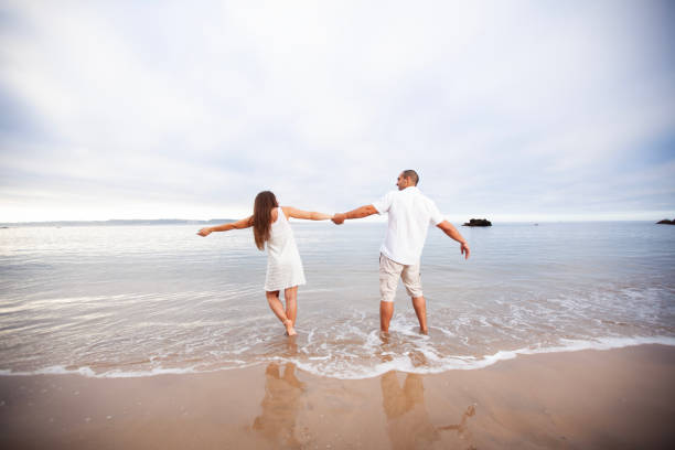 istock Couple walking at the beach 2173271982
