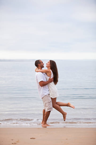 istock Couple having fun at the beach 2173271995