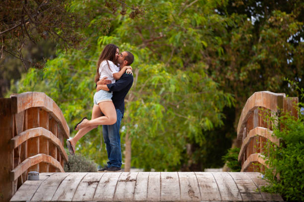 istock Couple having fun at the park 2173273236