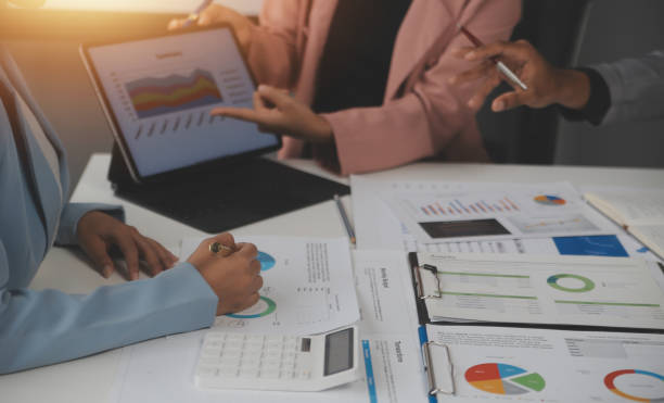 istock Close up of Business team analyzing income charts and graphs with modern laptop computer. Business analysis and strategy concept. 2173273665