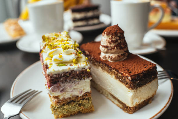 istock Delicious cakes and cappuccino on a table in a cafe 2173276094