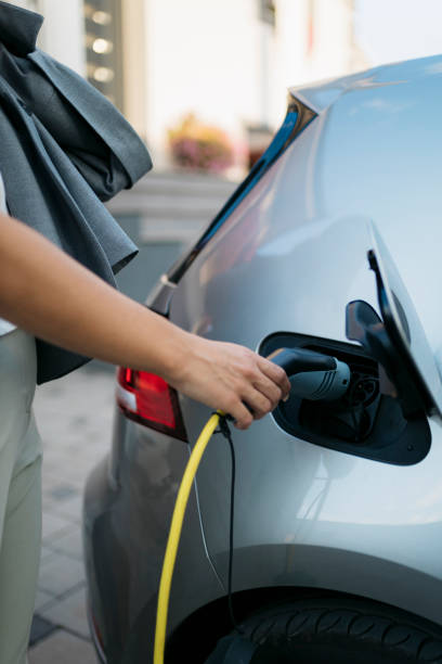 istock Woman disconnecting ev charger before trip 2173277326