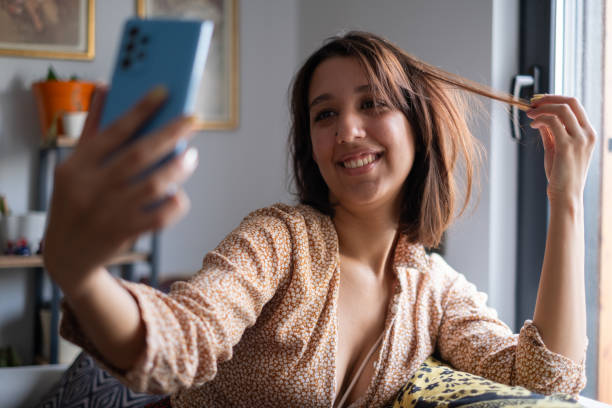 istock Young Woman Using Smartphone at Home 2173278633