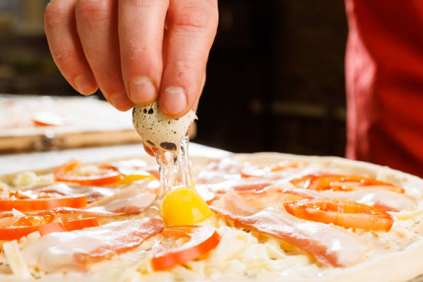 Cracking Quail Egg on Pizza