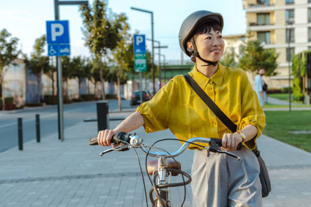 istock Cheerful Japanese female commuter with her bicycle 2173280786