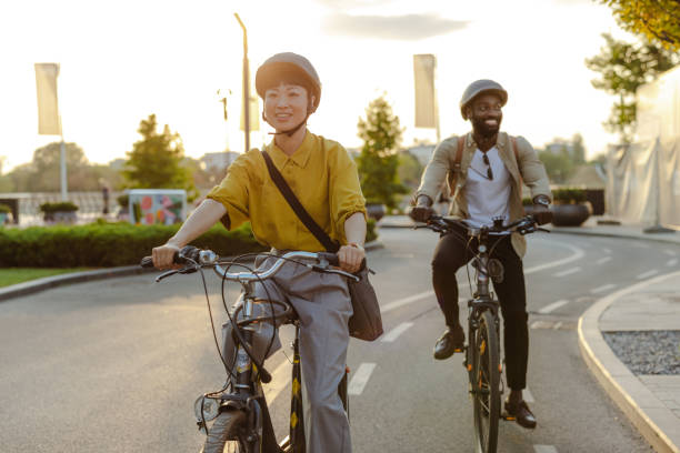 istock Two cyclists riding along a scenic path on a sunny day. Daily commuting to work 2173280854
