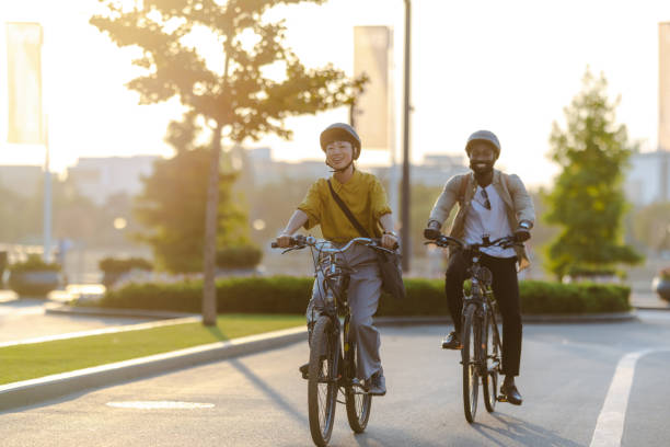 istock Two cyclists riding along a scenic path on a sunny day. daily commuting to work 2173281358