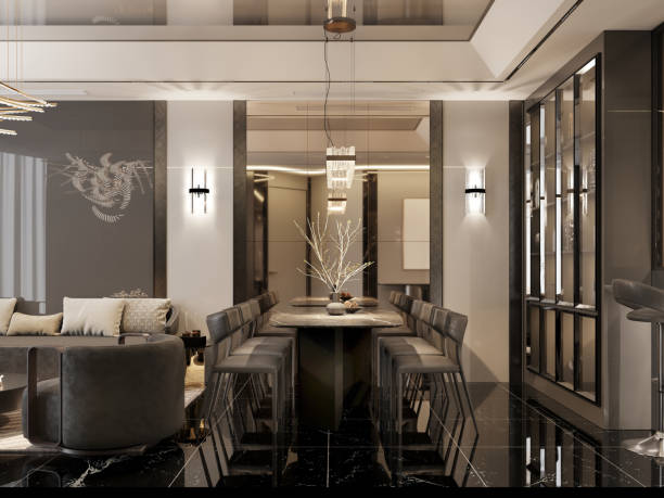 Luxurious dining space with a marble table, sleek bar chairs, and reflective black flooring. Modern lighting and sophisticated design create a chic, high-end ambiance.