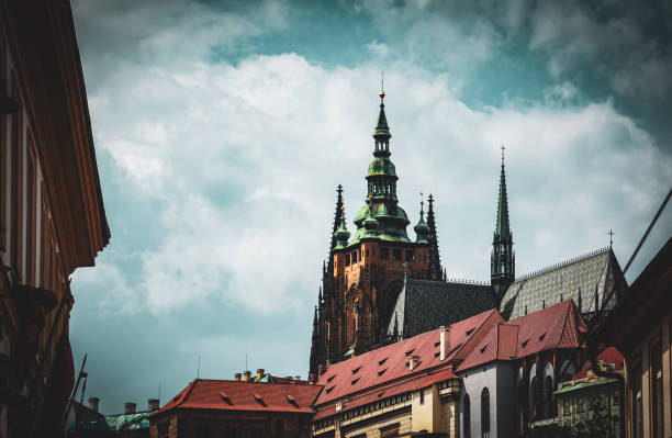 Low angle view of buildings against cloudy sky