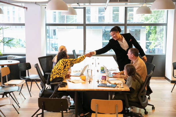 istock Business people shaking hands in office 2173299940