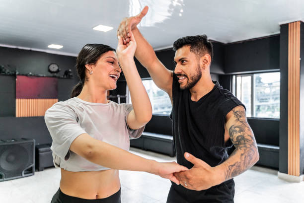 Young couple rehearsing in a dance studio
