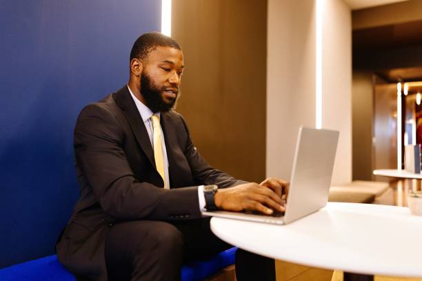 istock Side view of a businessman typing on his computer while working in the modern office space 2173306644