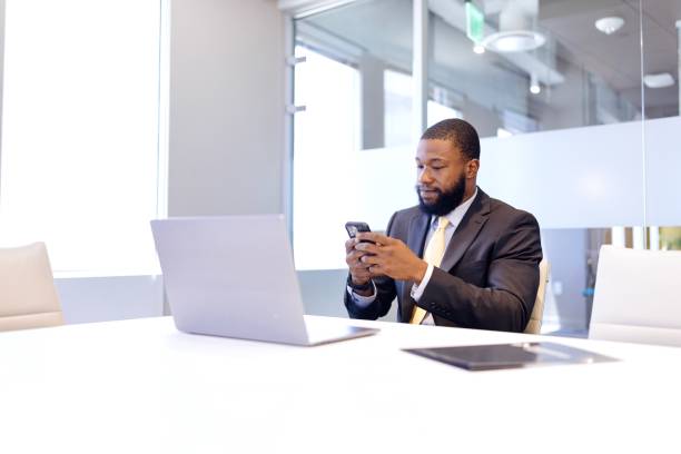 Man surfing the net while sitting in the modern office space